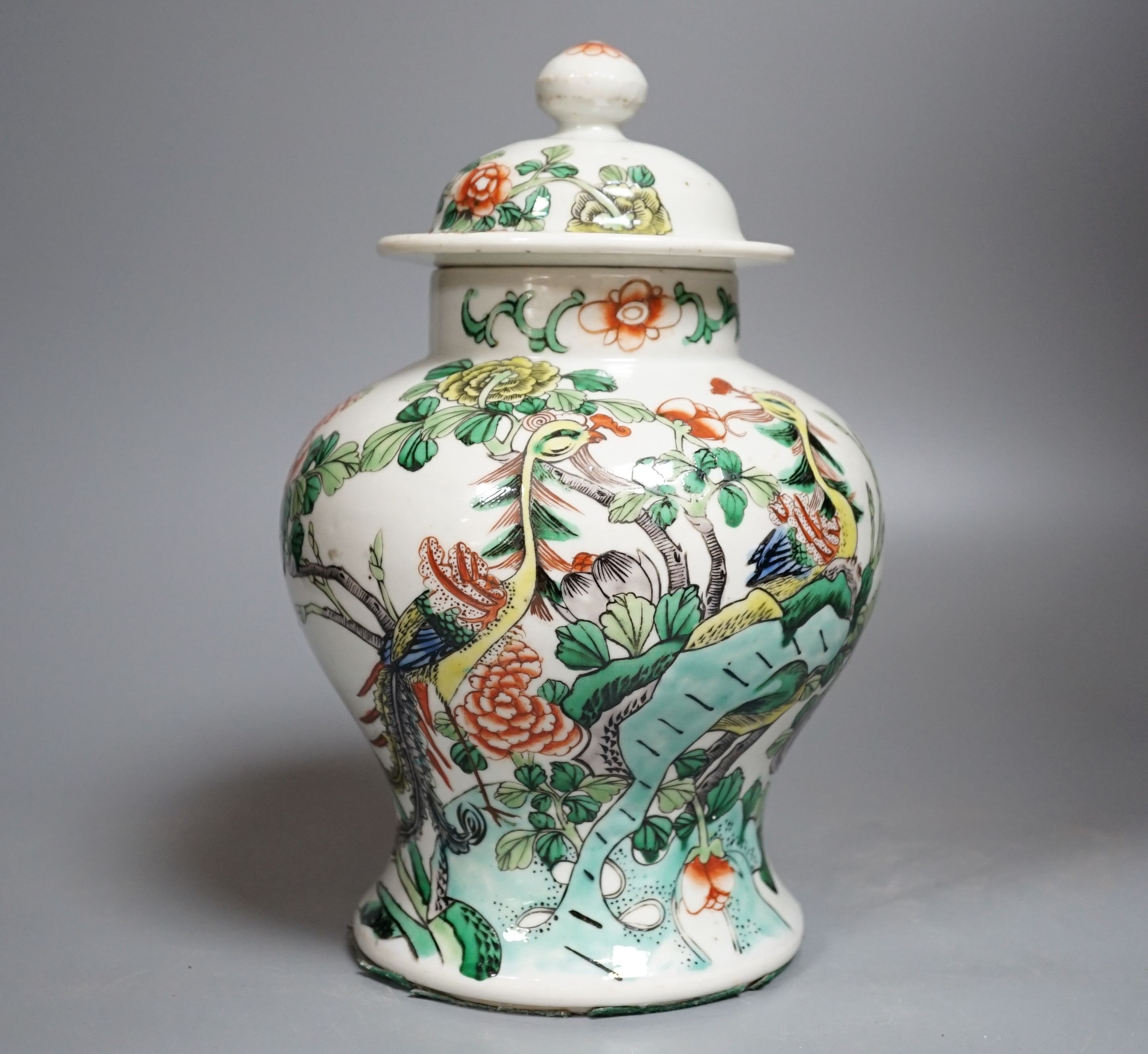 A Chinese Famille-Verte jar and cover decorated with Phoenix and flowers, 26cm